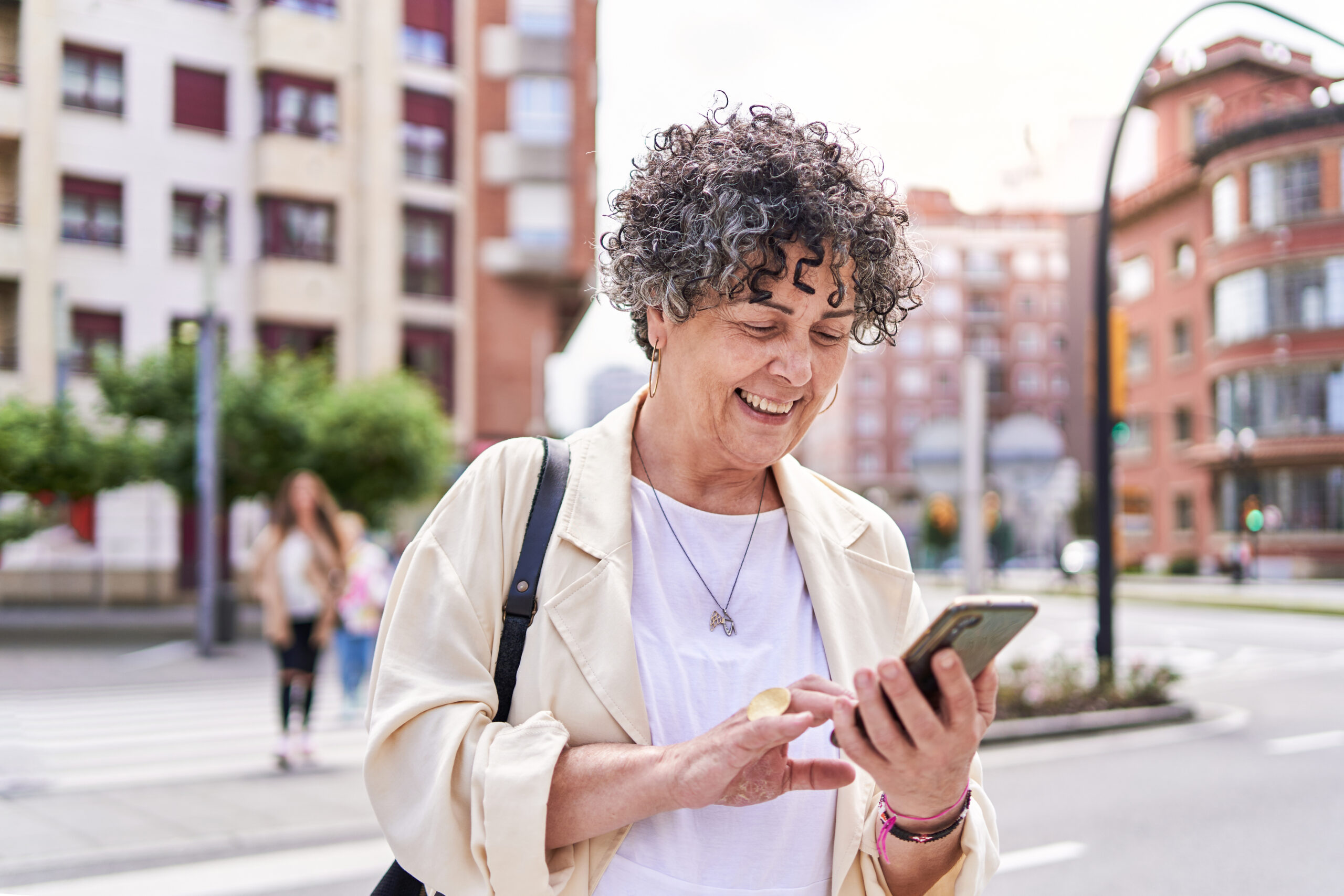 mature woman using Rently mobile app device on smartphone