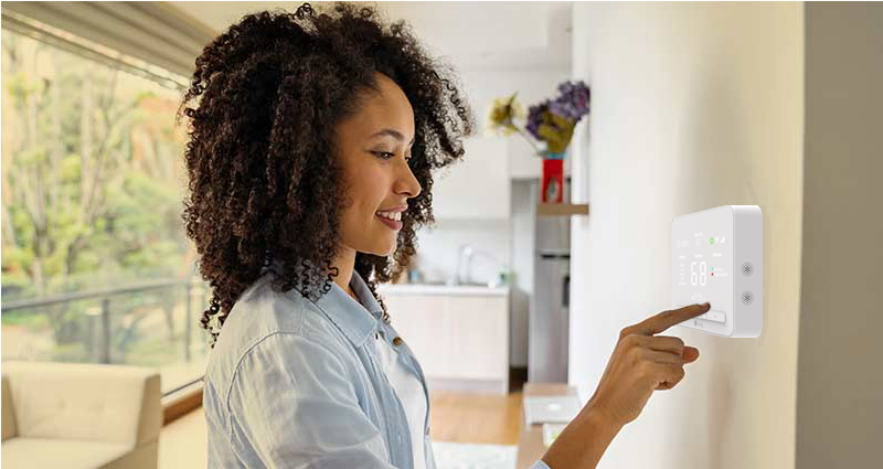 Woman interacting with the Rently Hub Pro on the wall